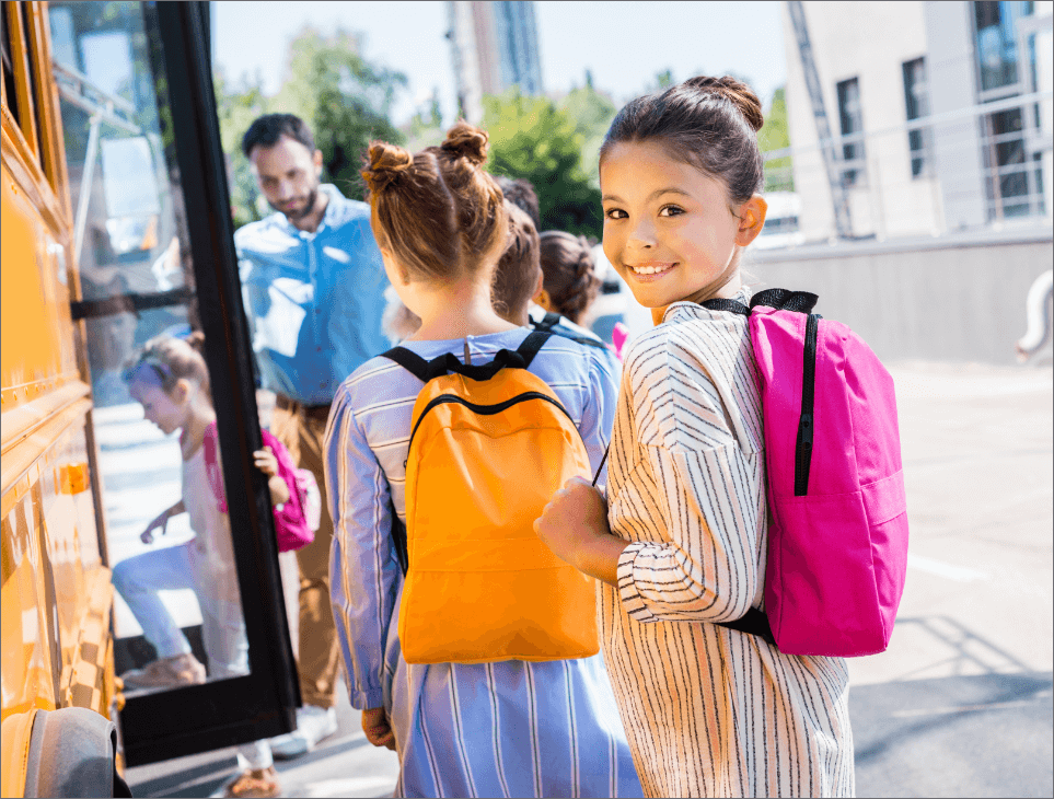 little-schoolgirl-entering-school-bus